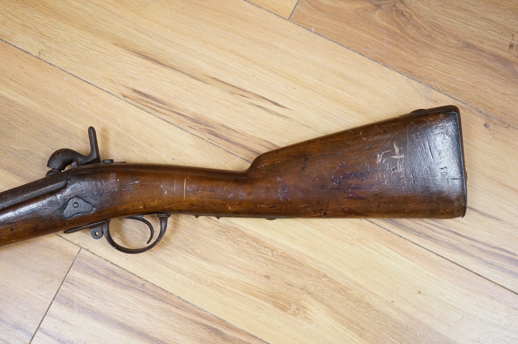 A 12 bore single barrel, back action, continental military percussion musket, barrel 93cm, possibly Russian, with regulation iron mounts and brass fore cap dated 1838